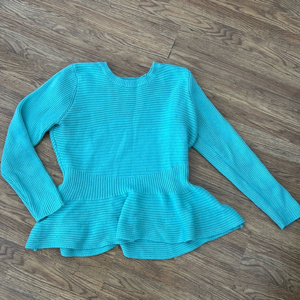 Women’s peplum sweater